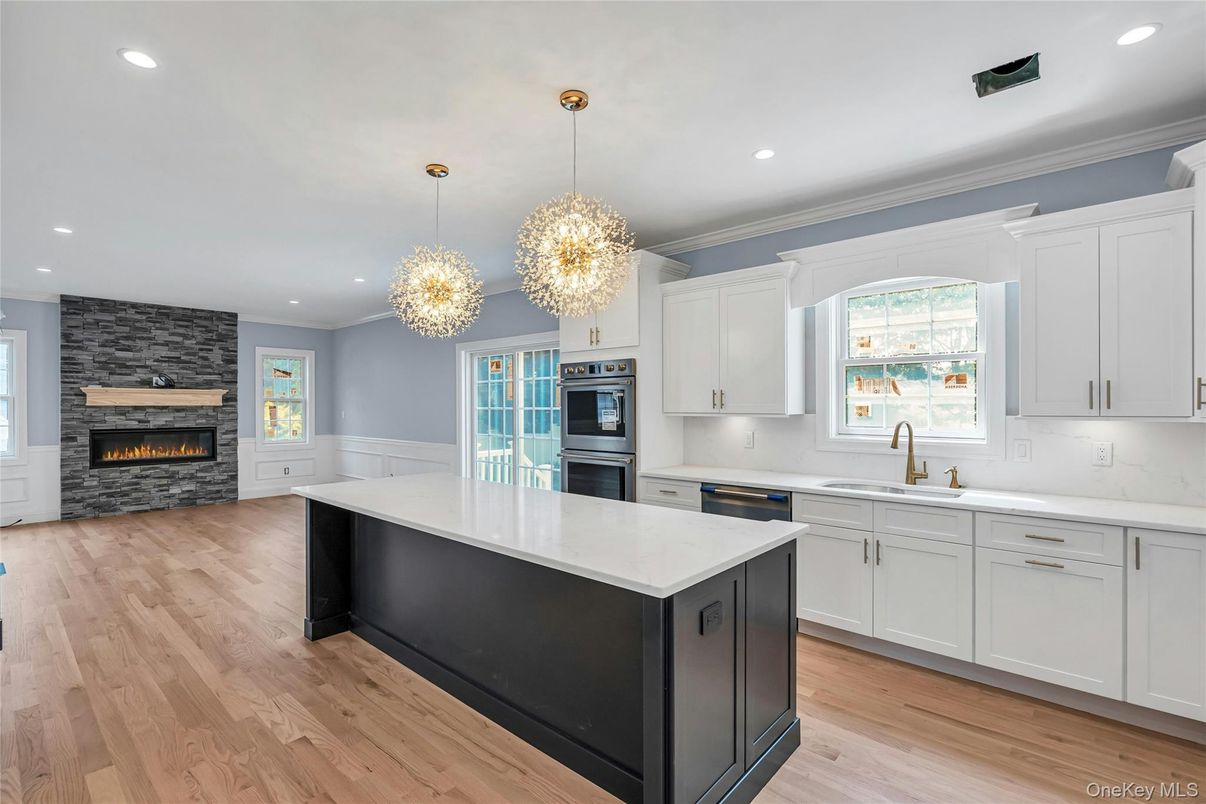 Fireplace, Interior, Kitchen, Pendant Lights, Recessed Lighting, Stainless Steel Appliances, Wood Texture Flooring