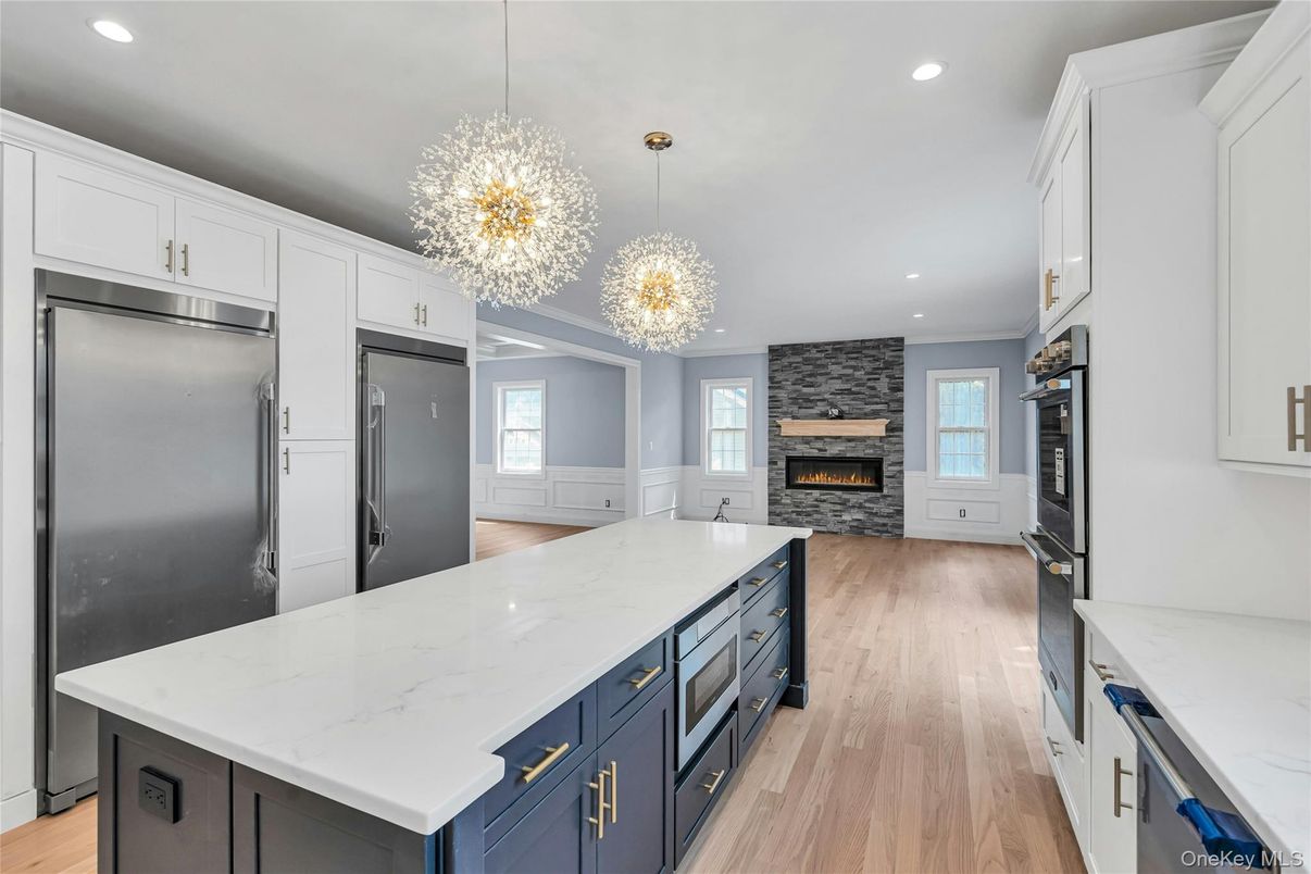 Chandelier, Fireplace, Interior, Kitchen, Pendant Lights, Recessed Lighting, Wood Texture Flooring