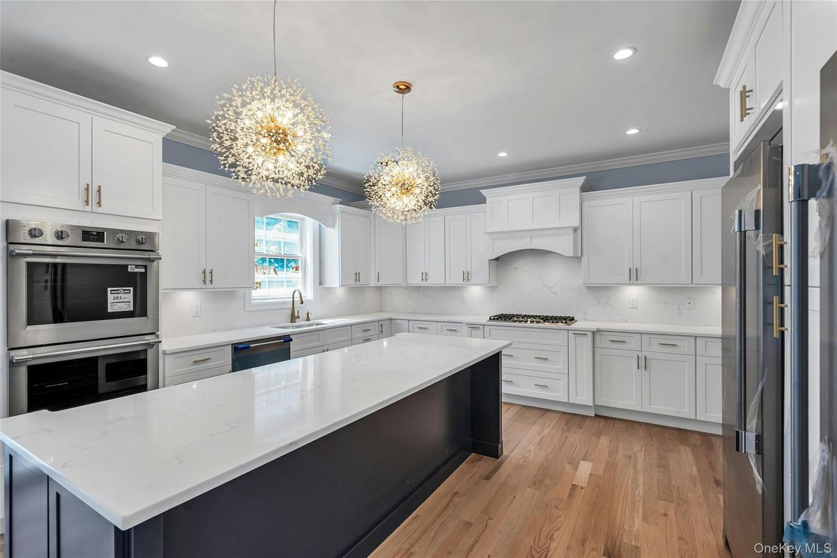 Chandelier, Interior, Kitchen, Pendant Lights, Recessed Lighting, Stainless Steel Appliances, Wood Texture Flooring