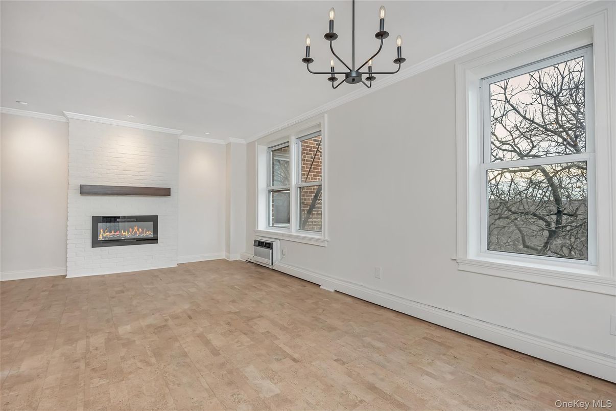 Chandelier, Empty room, Fireplace, Interior, Recessed Lighting, Wood Texture Flooring