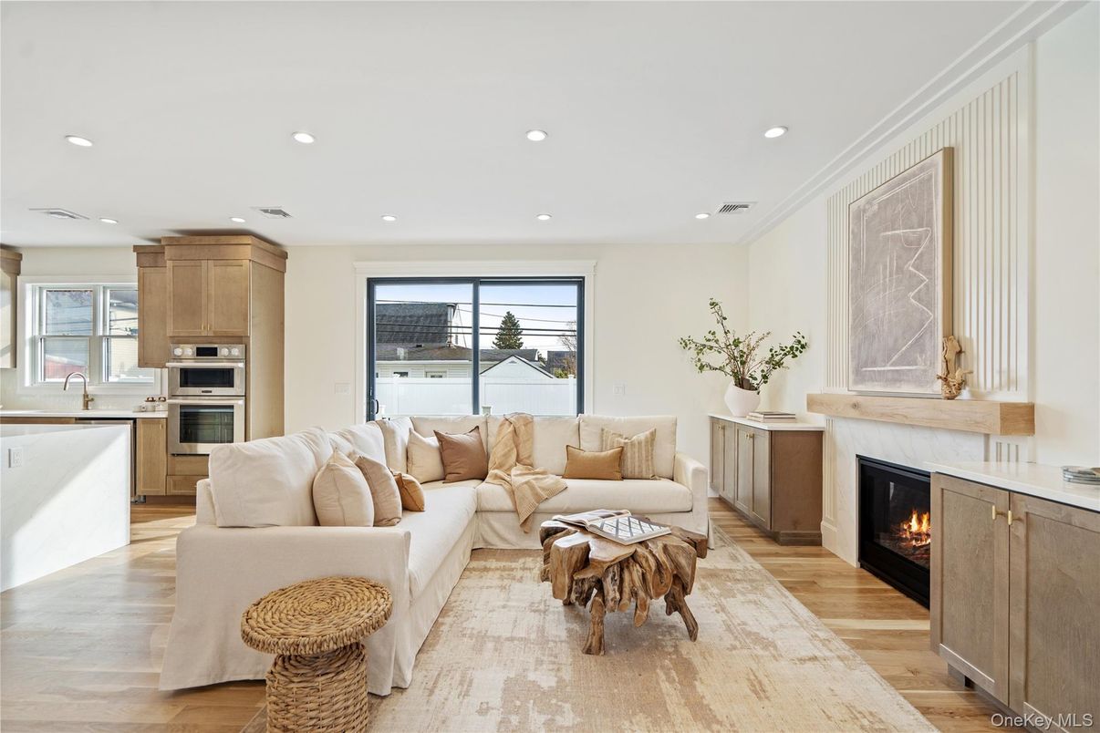 Fireplace, Interior, Kitchen, Living room, Recessed Lighting, Stainless Steel Appliances, Wood Texture Flooring