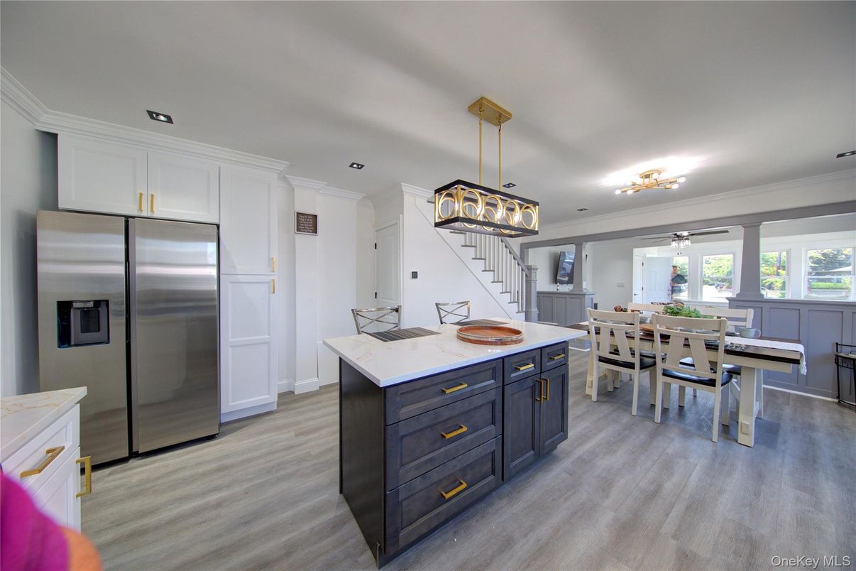 Dining room, Interior, Kitchen, Pendant Lights, Recessed Lighting, Stainless Steel Appliances, Wood Texture Flooring