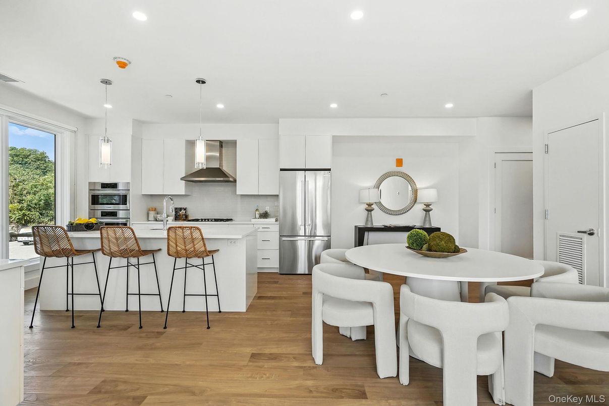 Dining room, Interior, Kitchen, Pendant Lights, Recessed Lighting, Stainless Steel Appliances, Wood Texture Flooring