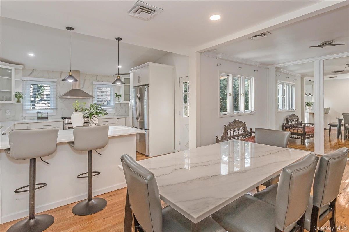 Dining room, Interior, Kitchen, Pendant Lights, Recessed Lighting, Stainless Steel Appliances, Wood Texture Flooring