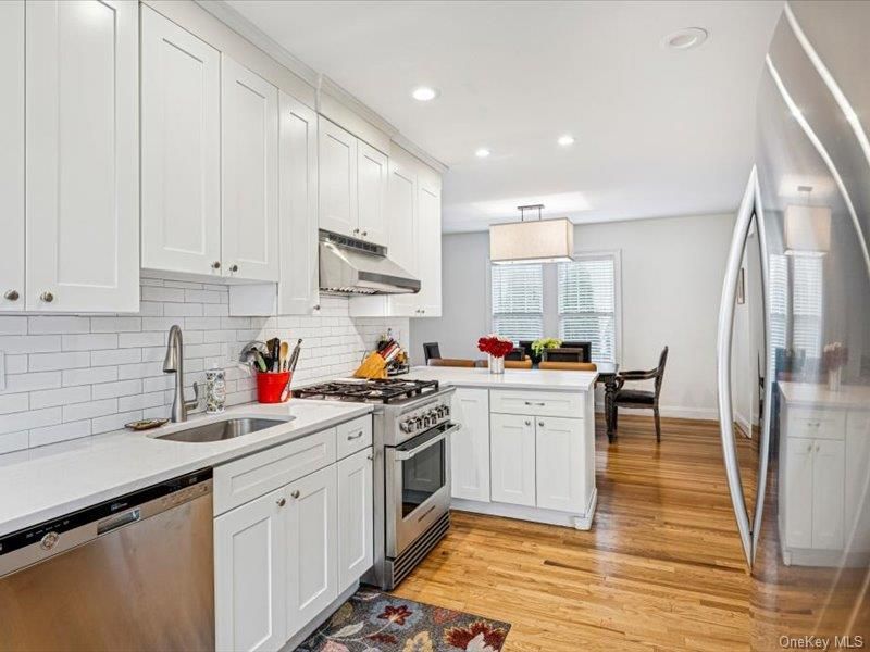 Dining room, Interior, Kitchen, Pendant Lights, Recessed Lighting, Stainless Steel Appliances, Wood Texture Flooring