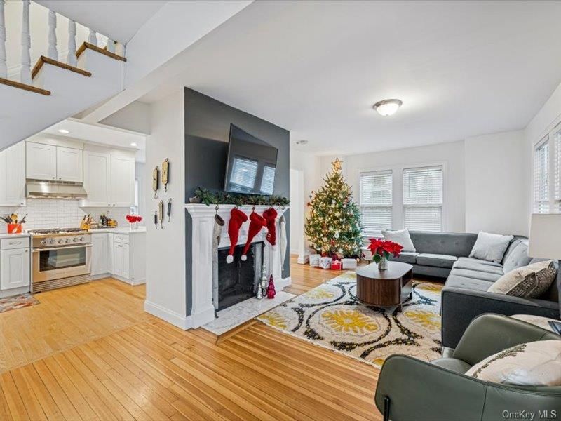 Fireplace, Interior, Kitchen, Living room, Recessed Lighting, Stainless Steel Appliances, Wood Texture Flooring