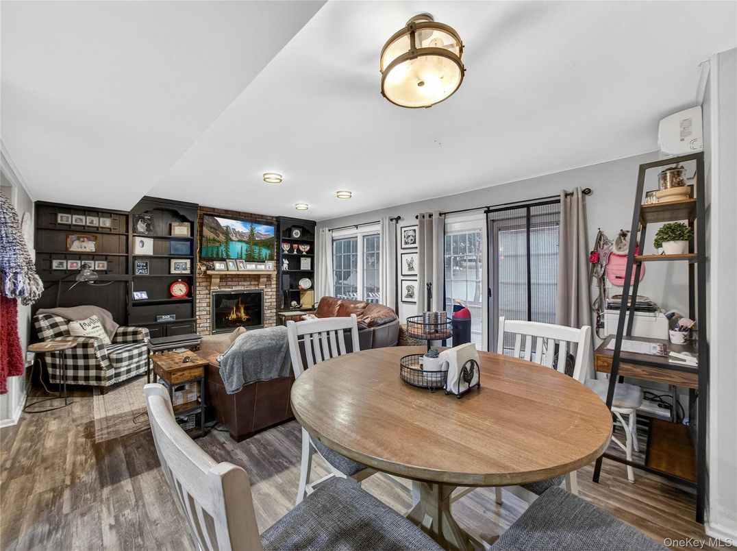 Dining room, Fireplace, Interior, Living room, Recessed Lighting, Wood Texture Flooring