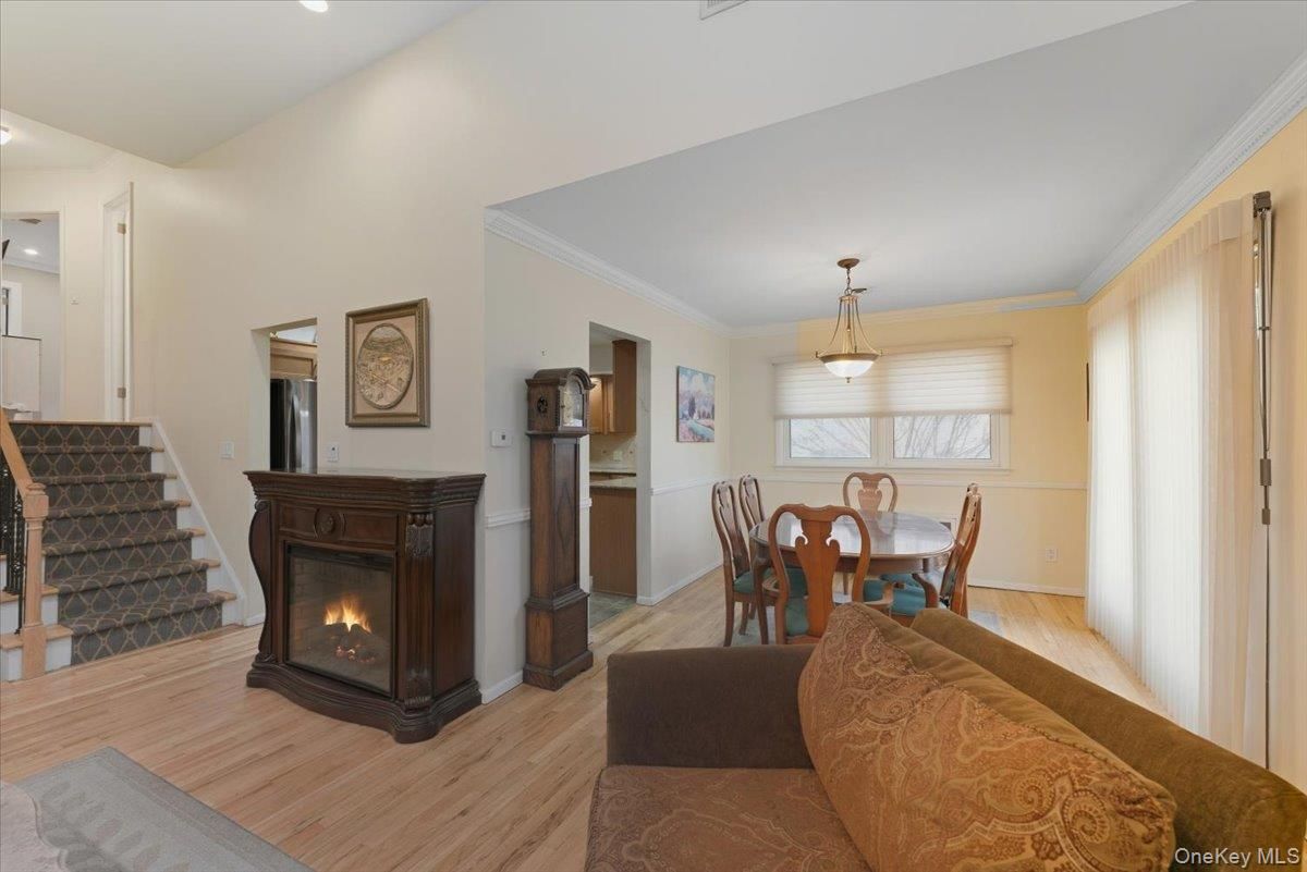 Dining room, Fireplace, Interior, Pendant Lights, Recessed Lighting, Wood Texture Flooring