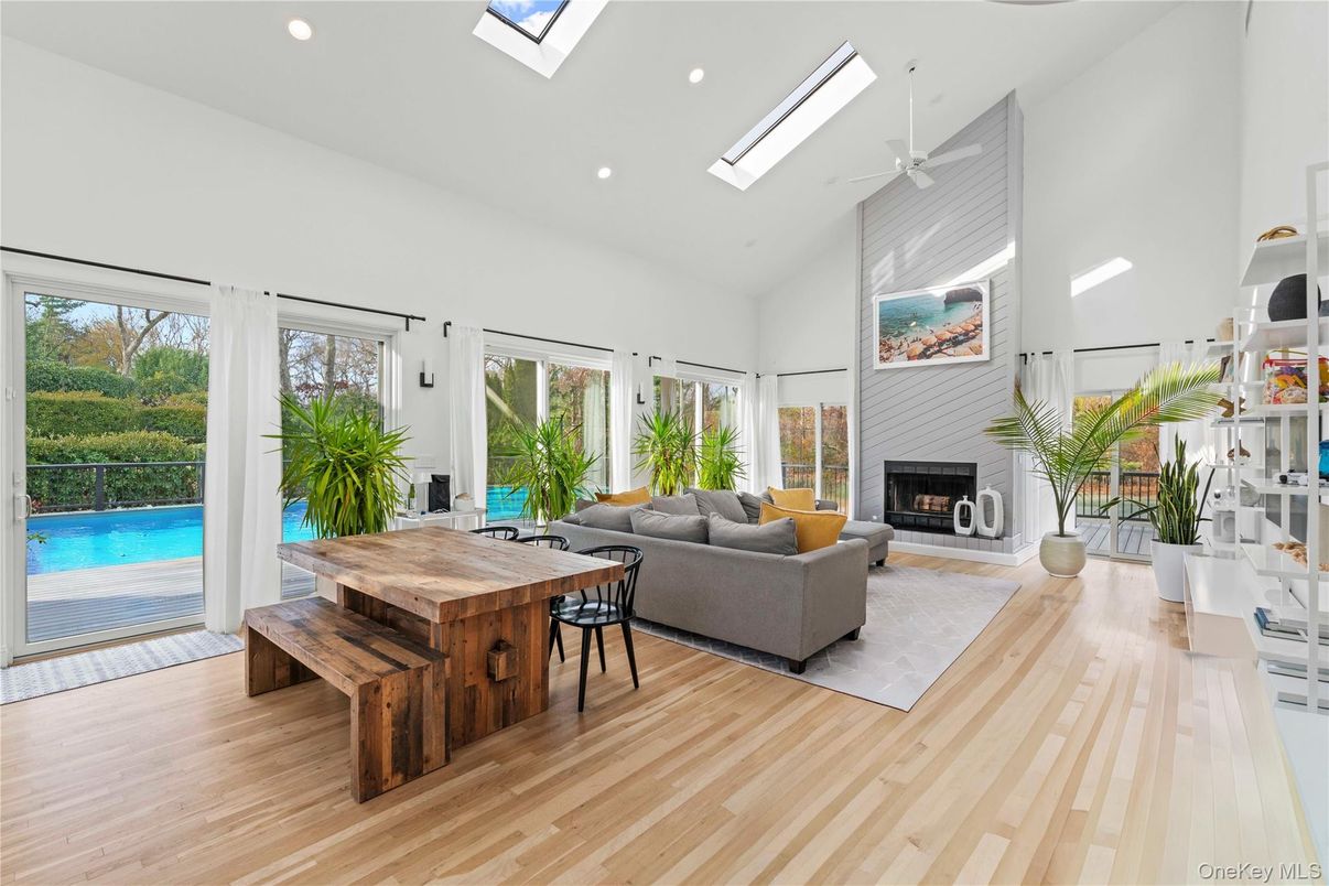 Dining room, Fireplace, Interior, Living room, Recessed Lighting, Wood Texture Flooring