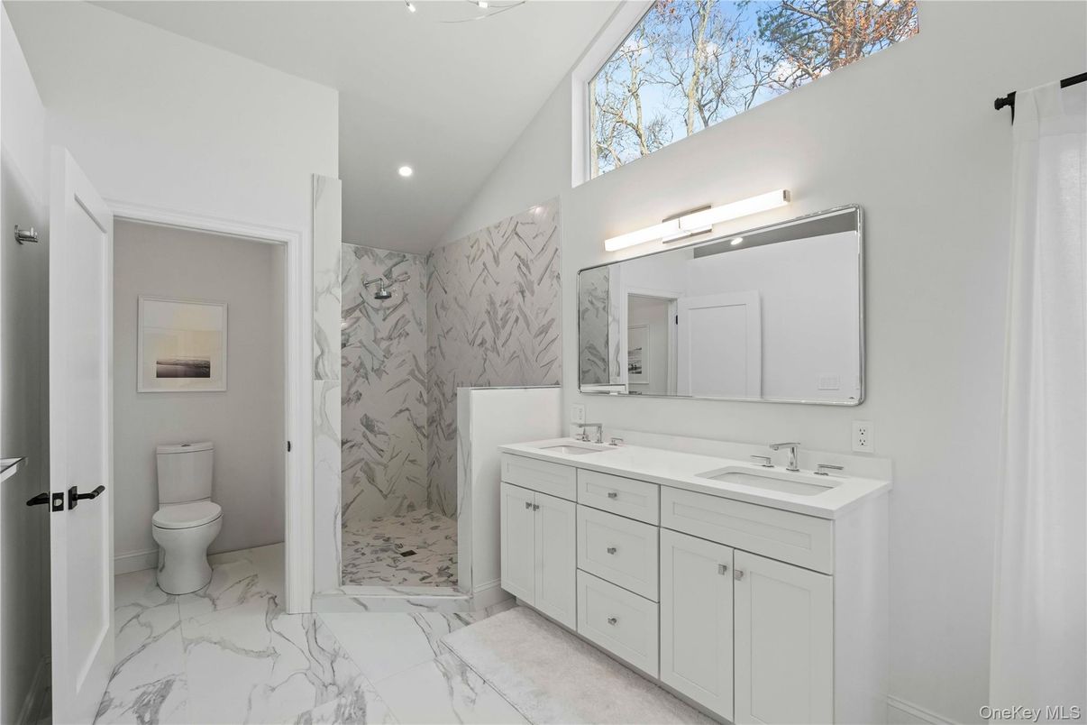Bathroom, Dual Sink Vanities, Interior, Marble, Marble Walls, Recessed Lighting