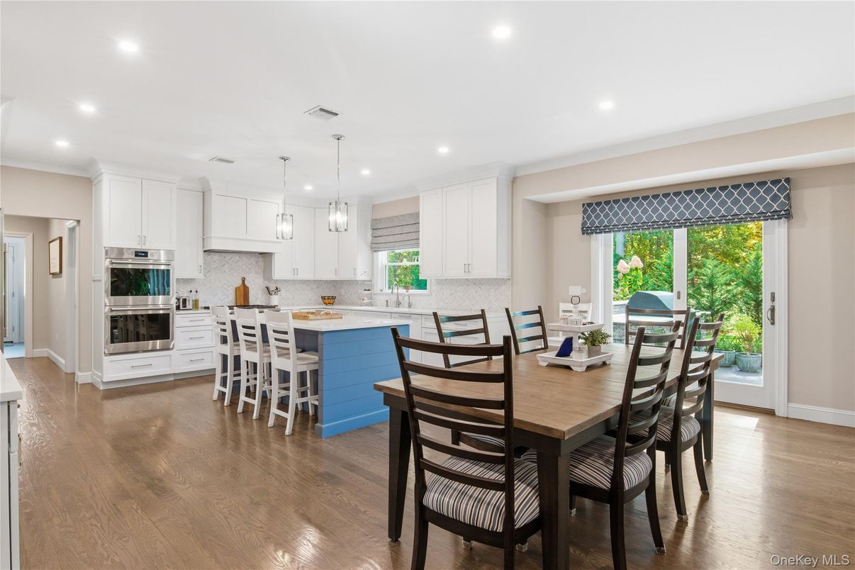 Dining room, Interior, Kitchen, Pendant Lights, Recessed Lighting, Stainless Steel Appliances, Wood Texture Flooring