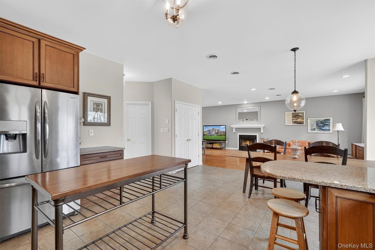 Dining room, Fireplace, Interior, Kitchen, Pendant Lights, Recessed Lighting, Stainless Steel Appliances