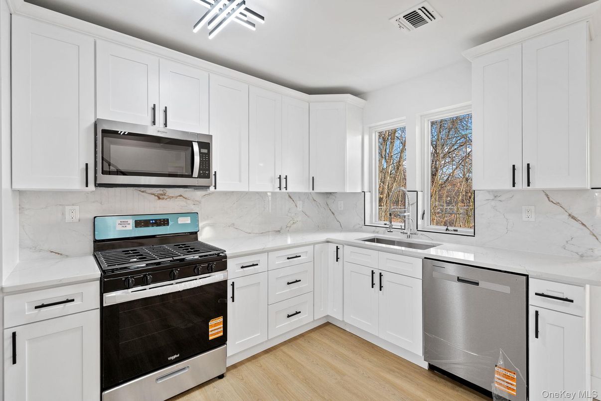 Interior, Kitchen, Marble Walls, Stainless Steel Appliances, Wood Texture Flooring