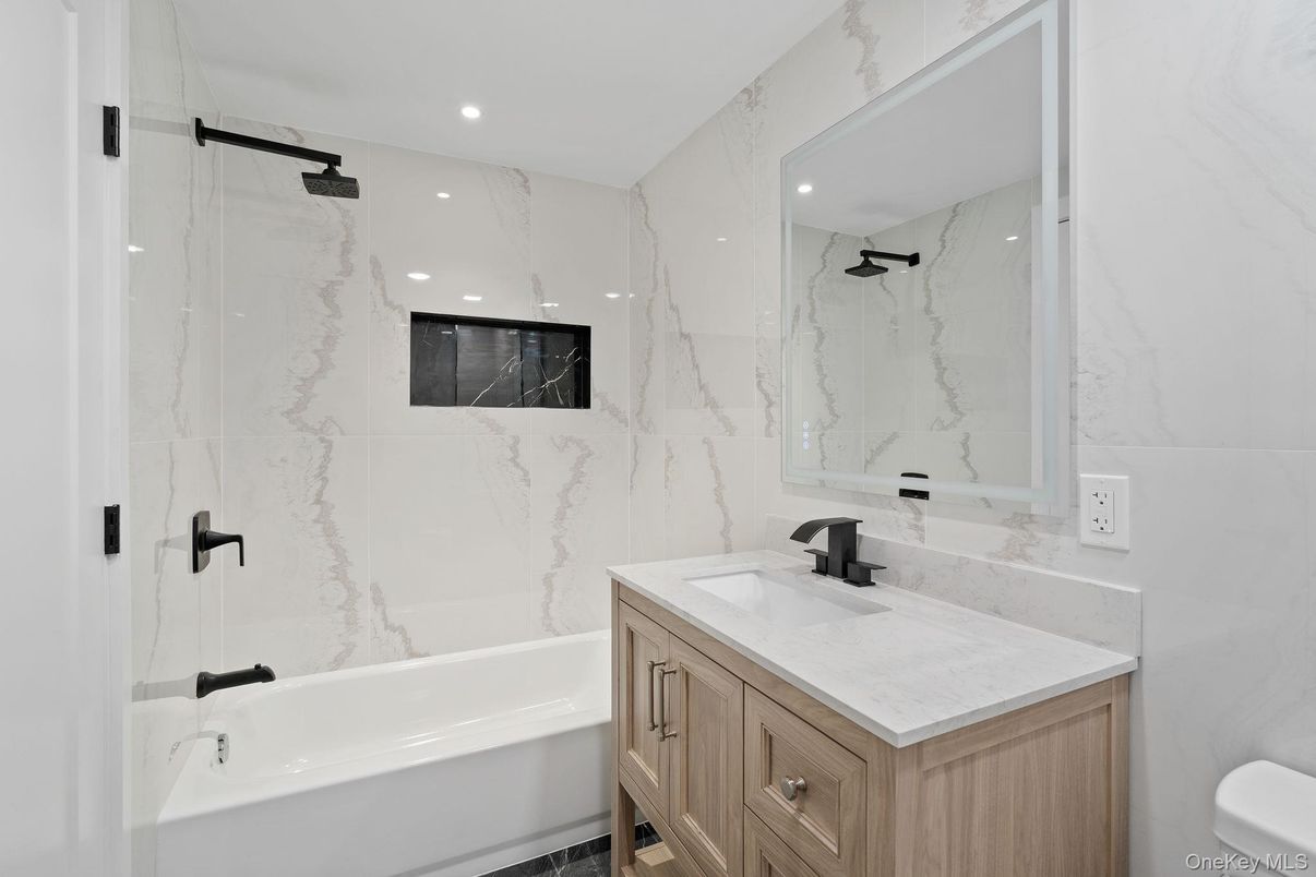 Bathroom, Dual Sink Vanities, Interior, Marble Walls, Recessed Lighting