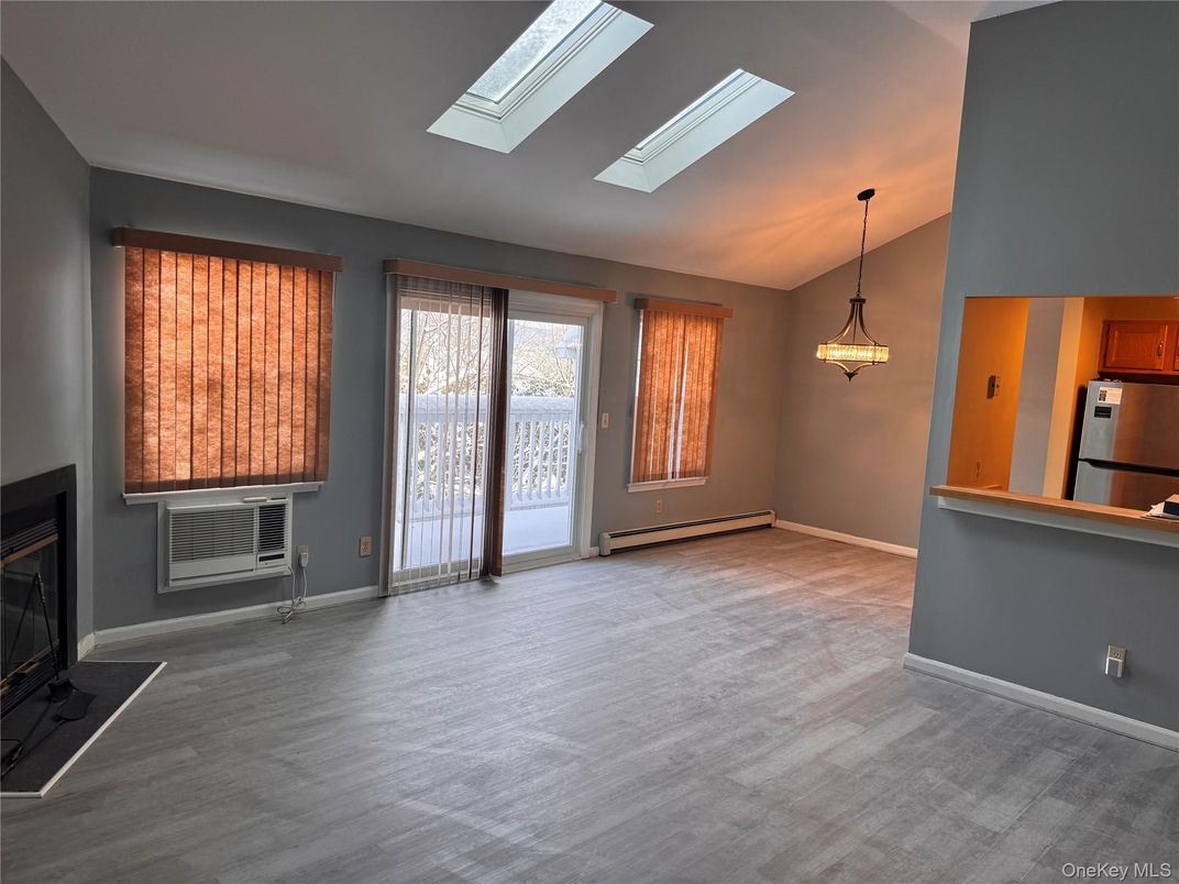 Empty room, Fireplace, Interior, Kitchen, Pendant Lights, Wood Texture Flooring