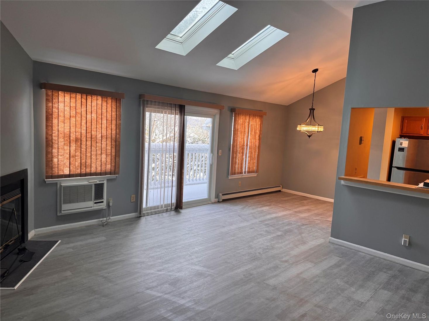 Empty room, Fireplace, Interior, Kitchen, Pendant Lights, Wood Texture Flooring