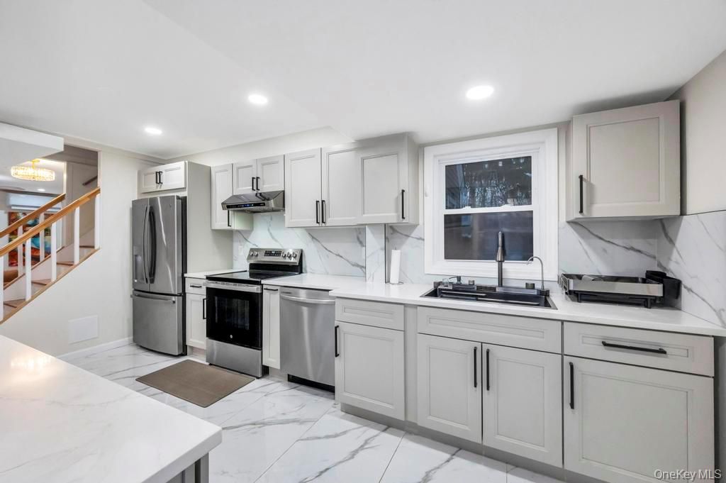 Interior, Kitchen, Marble, Marble Walls, Recessed Lighting, Stainless Steel Appliances