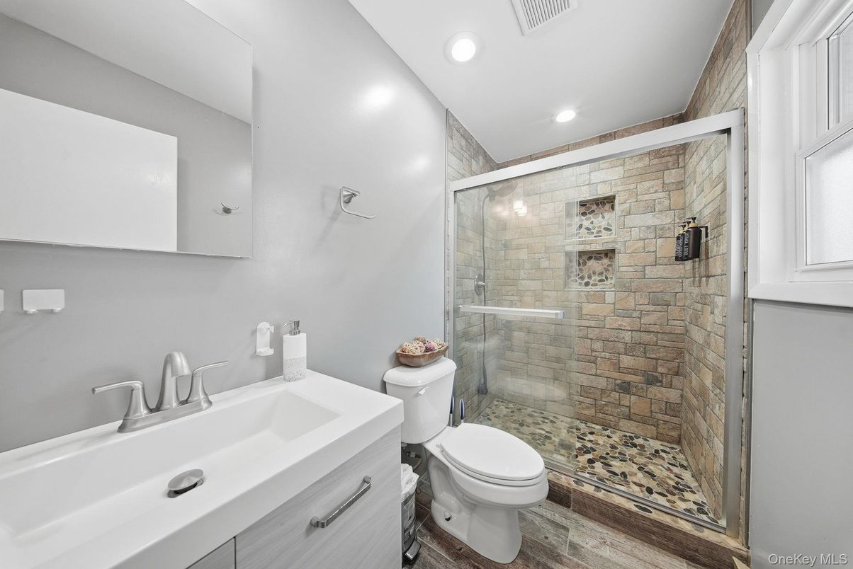 Bathroom, Glass Shower, Interior, Recessed Lighting, Stone Walls, Wood Texture Flooring