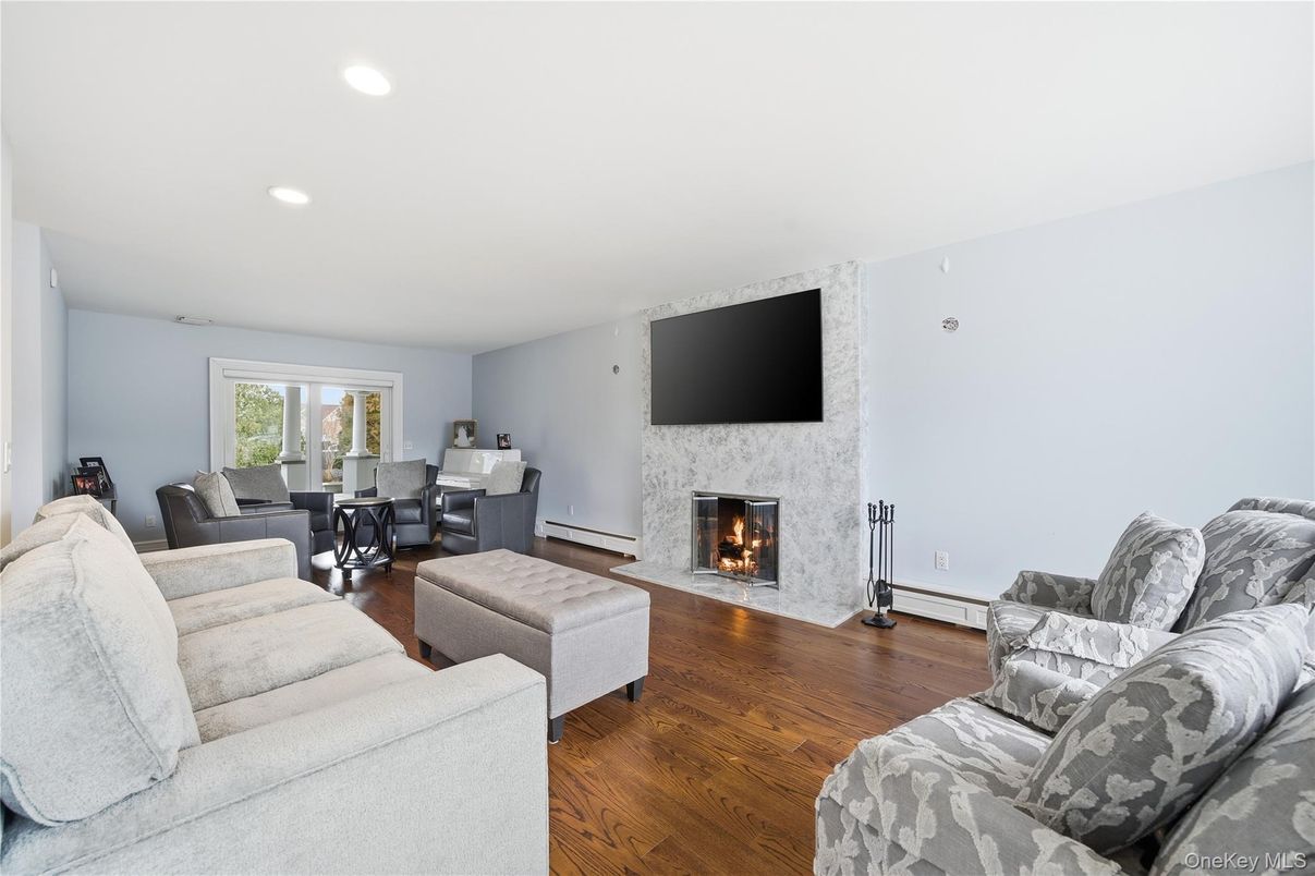 Dining room, Fireplace, Interior, Living room, Recessed Lighting, Wood Texture Flooring