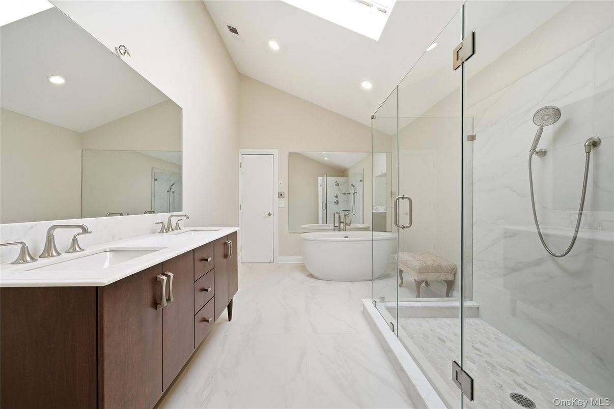 Bathroom, Dual Sink Vanities, Free Standing Baths, Glass Shower, Interior, Marble, Marble Walls, Recessed Lighting