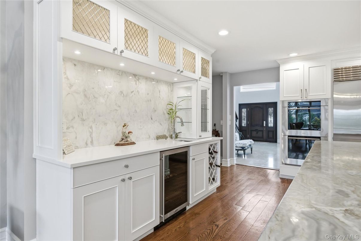 Interior, Kitchen, Marble Walls, Recessed Lighting, Stainless Steel Appliances, Wood Texture Flooring