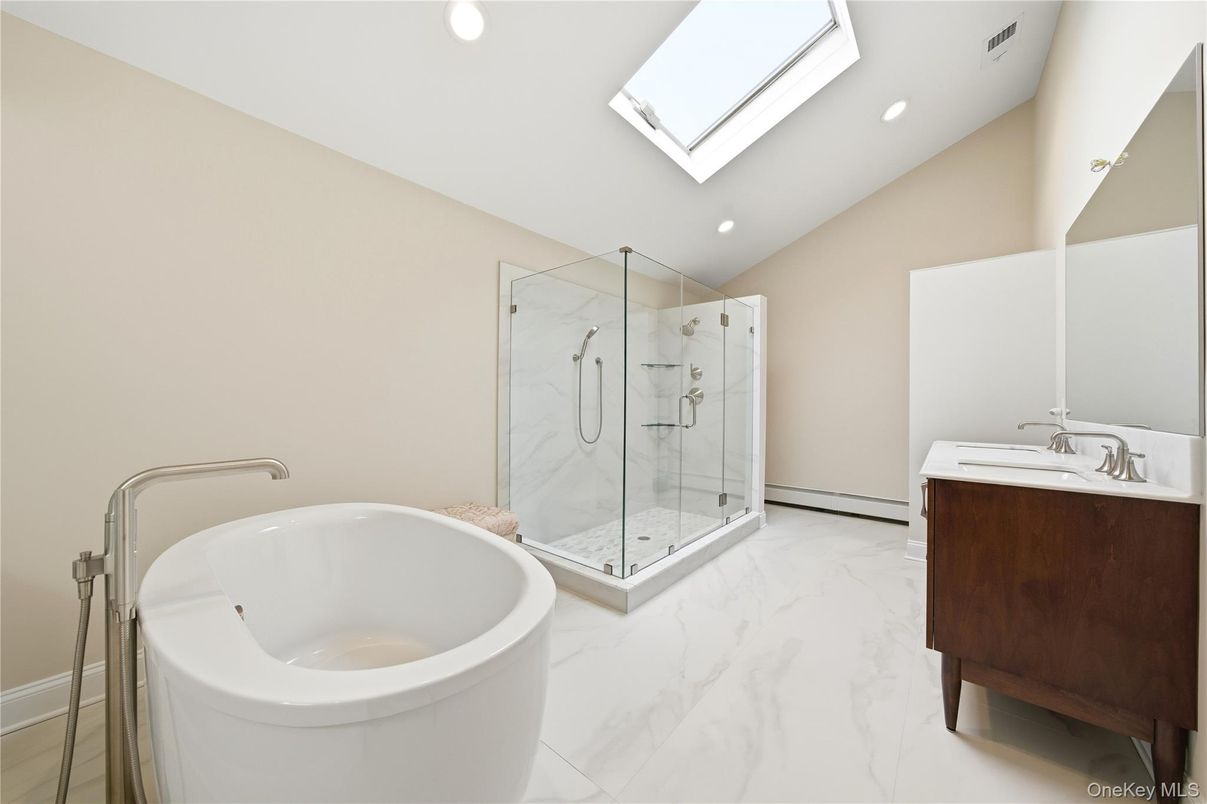 Bathroom, Dual Sink Vanities, Free Standing Baths, Glass Shower, Interior, Marble, Marble Walls, Recessed Lighting