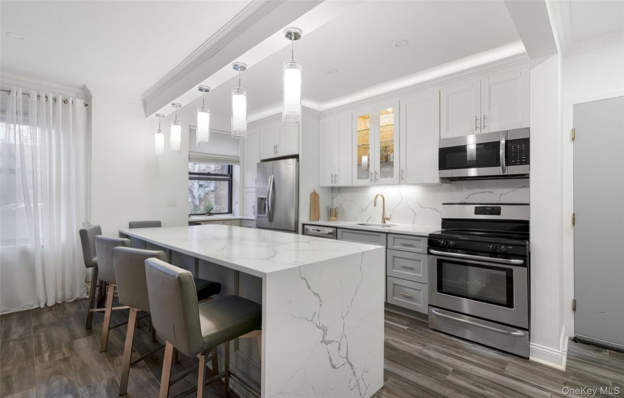 Interior, Kitchen, Marble Walls, Pendant Lights, Recessed Lighting, Stainless Steel Appliances, Wood Texture Flooring