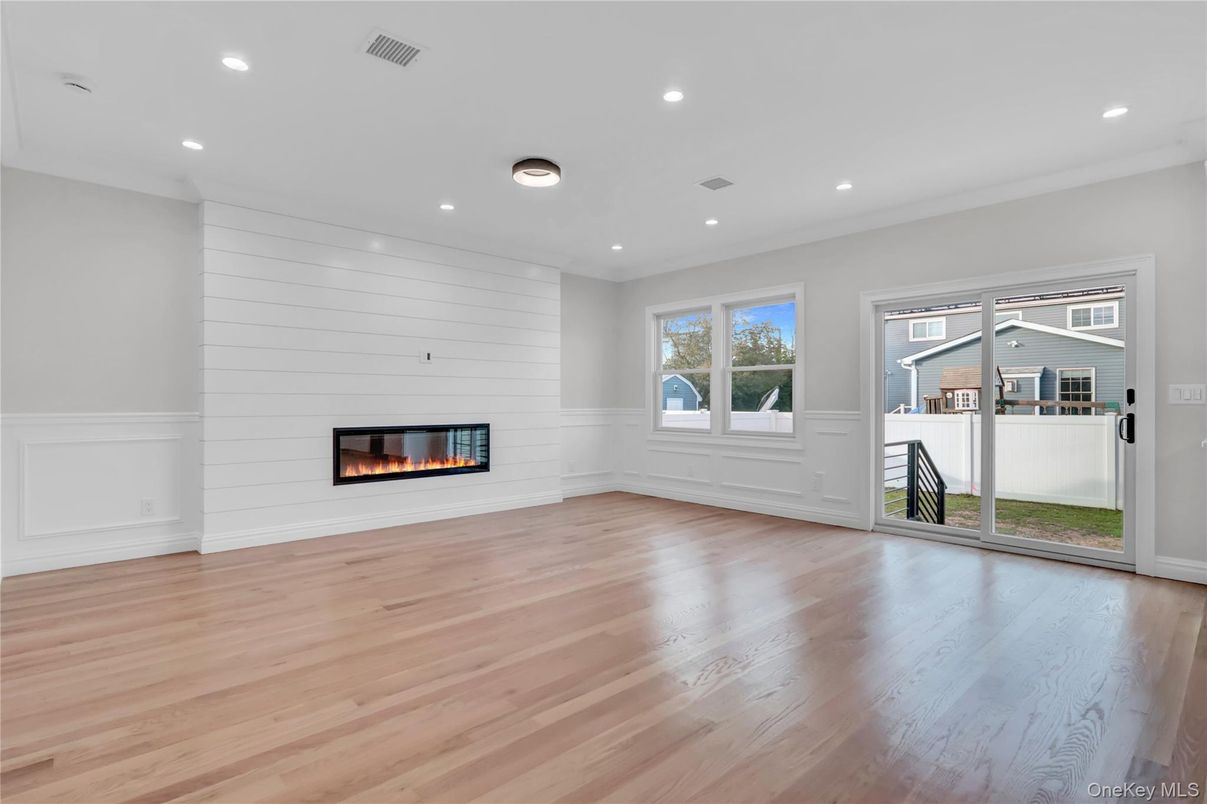 Empty room, Fireplace, Interior, Recessed Lighting, Wood Texture Flooring