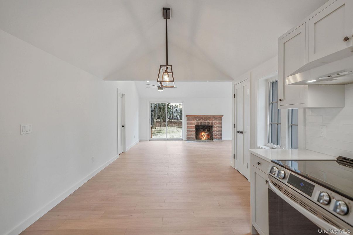 Fireplace, Interior, Kitchen, Pendant Lights, Stainless Steel Appliances, Wood Texture Flooring