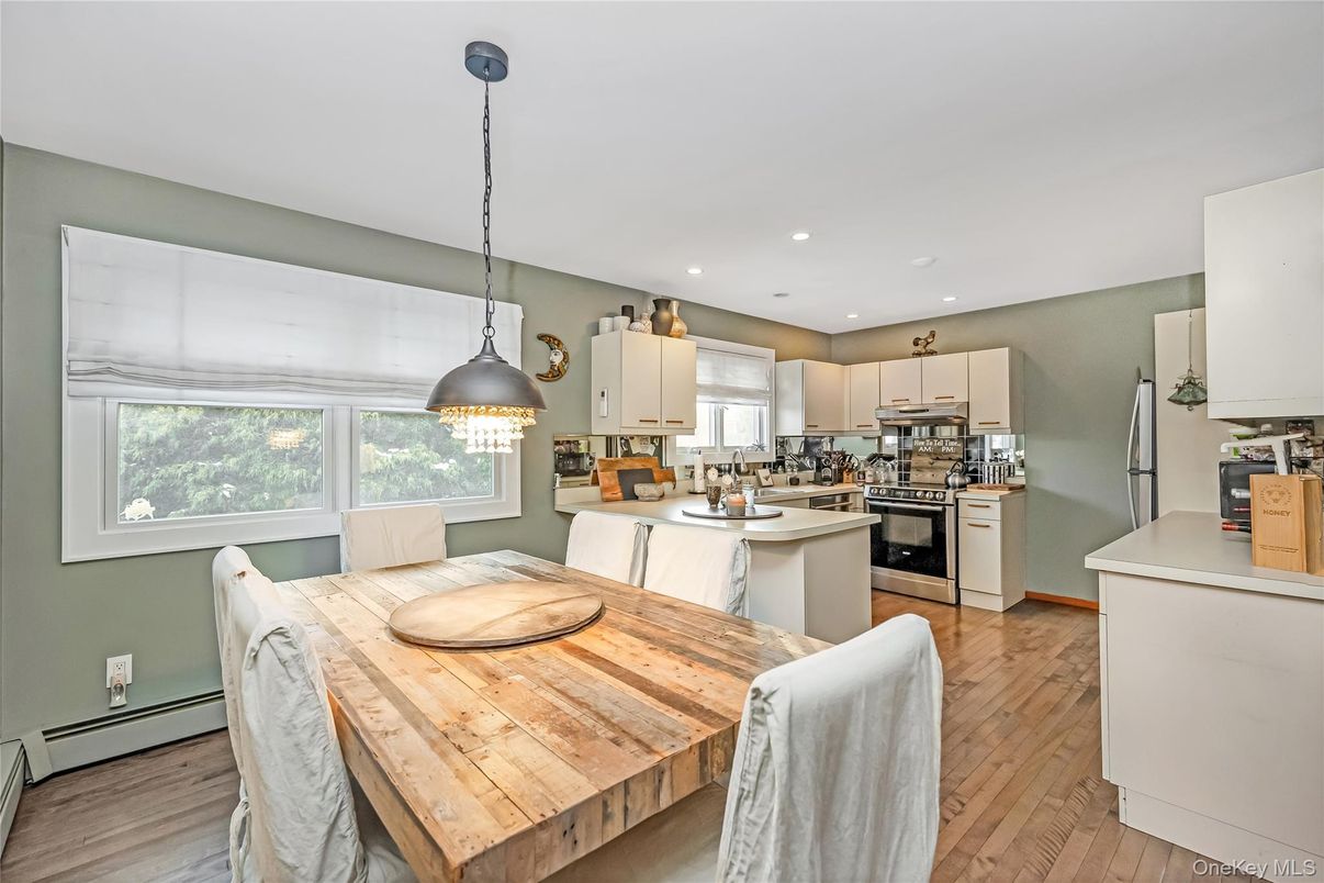 Dining room, Interior, Kitchen, Pendant Lights, Recessed Lighting, Stainless Steel Appliances, Wood Texture Flooring