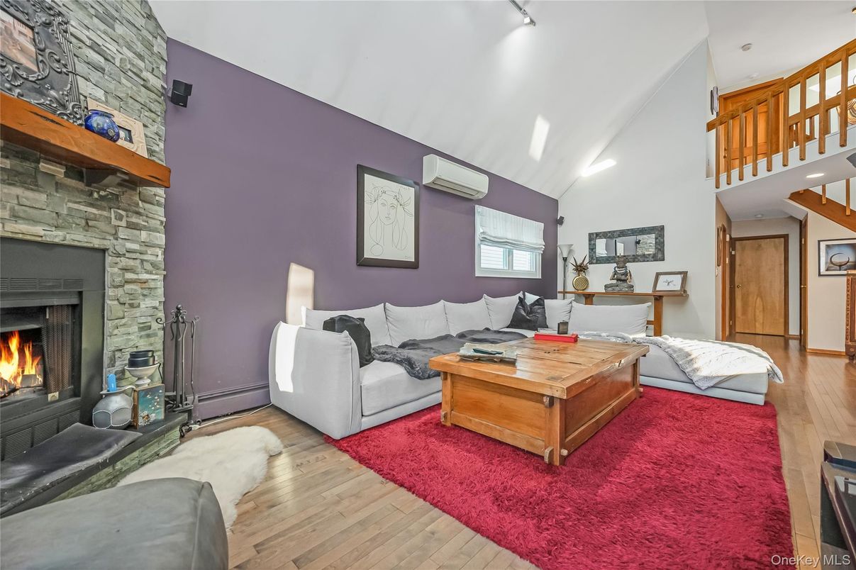 Fireplace, Interior, Living room, Recessed Lighting, Stone Walls, Wood Texture Flooring