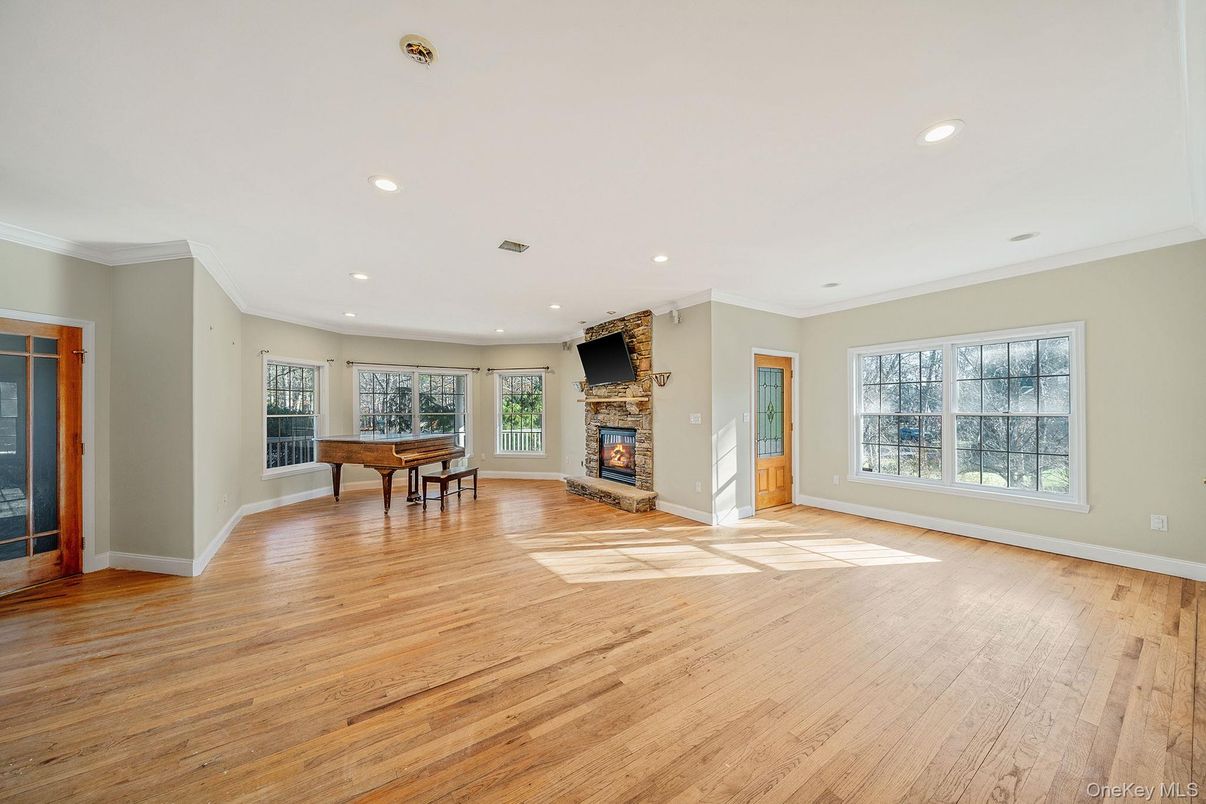 Dining room, Empty room, Fireplace, Game Room, Interior, Recessed Lighting, Wood Texture Flooring
