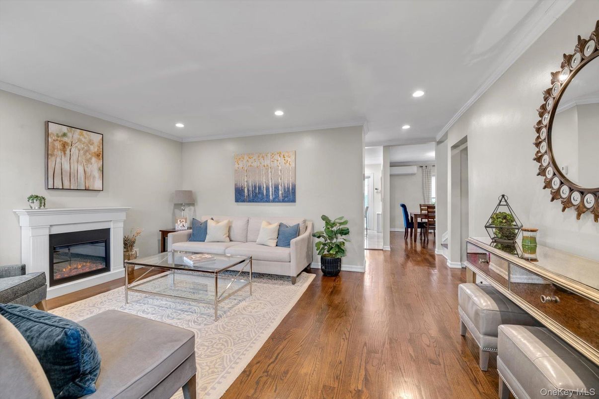 Dining room, Fireplace, Interior, Living room, Recessed Lighting, Wood Texture Flooring