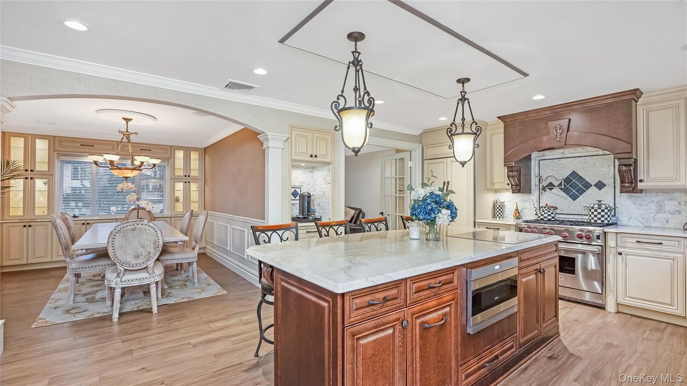 Chandelier, Dining room, Interior, Kitchen, Pendant Lights, Recessed Lighting, Stainless Steel Appliances, Wood Texture Flooring