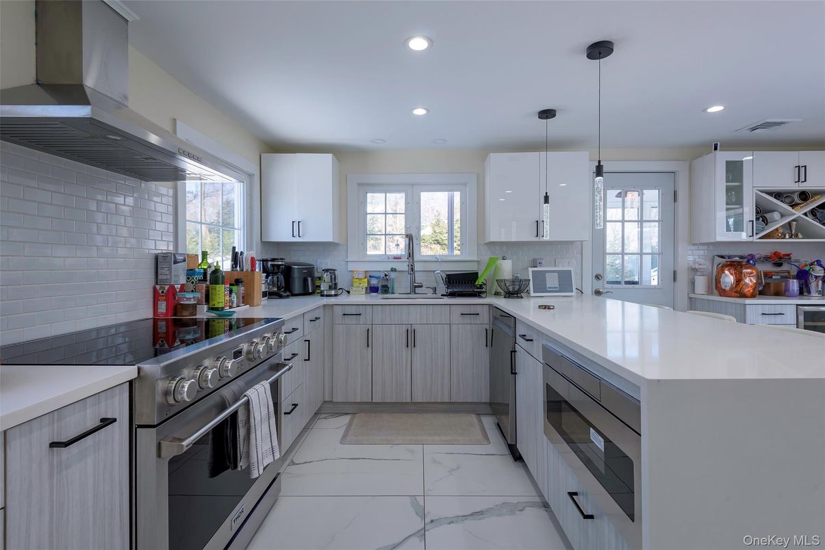 Interior, Kitchen, Marble, Pendant Lights, Recessed Lighting, Stainless Steel Appliances, Stone Walls