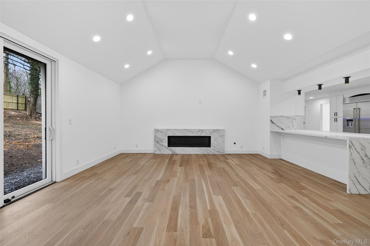 Empty room, Fireplace, Interior, Kitchen, Recessed Lighting, Wood Texture Flooring