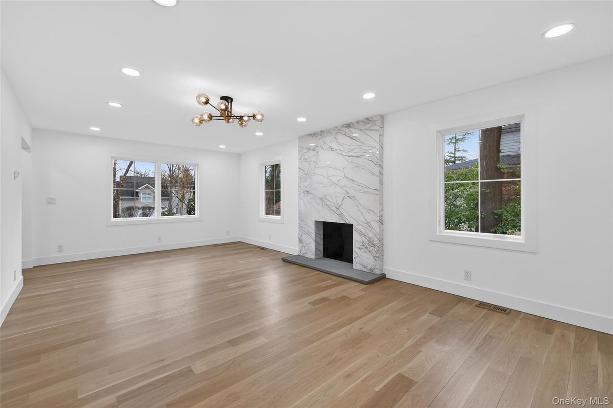 Empty room, Fireplace, Interior, Marble Walls, Recessed Lighting, Wood Texture Flooring