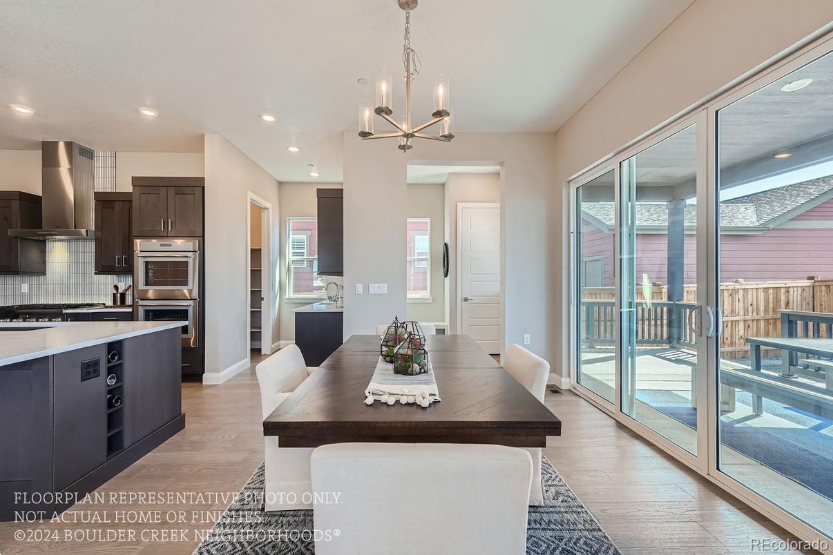 Chandelier, Dining room, Interior, Kitchen, Recessed Lighting, Stainless Steel Appliances, Wood Texture Flooring