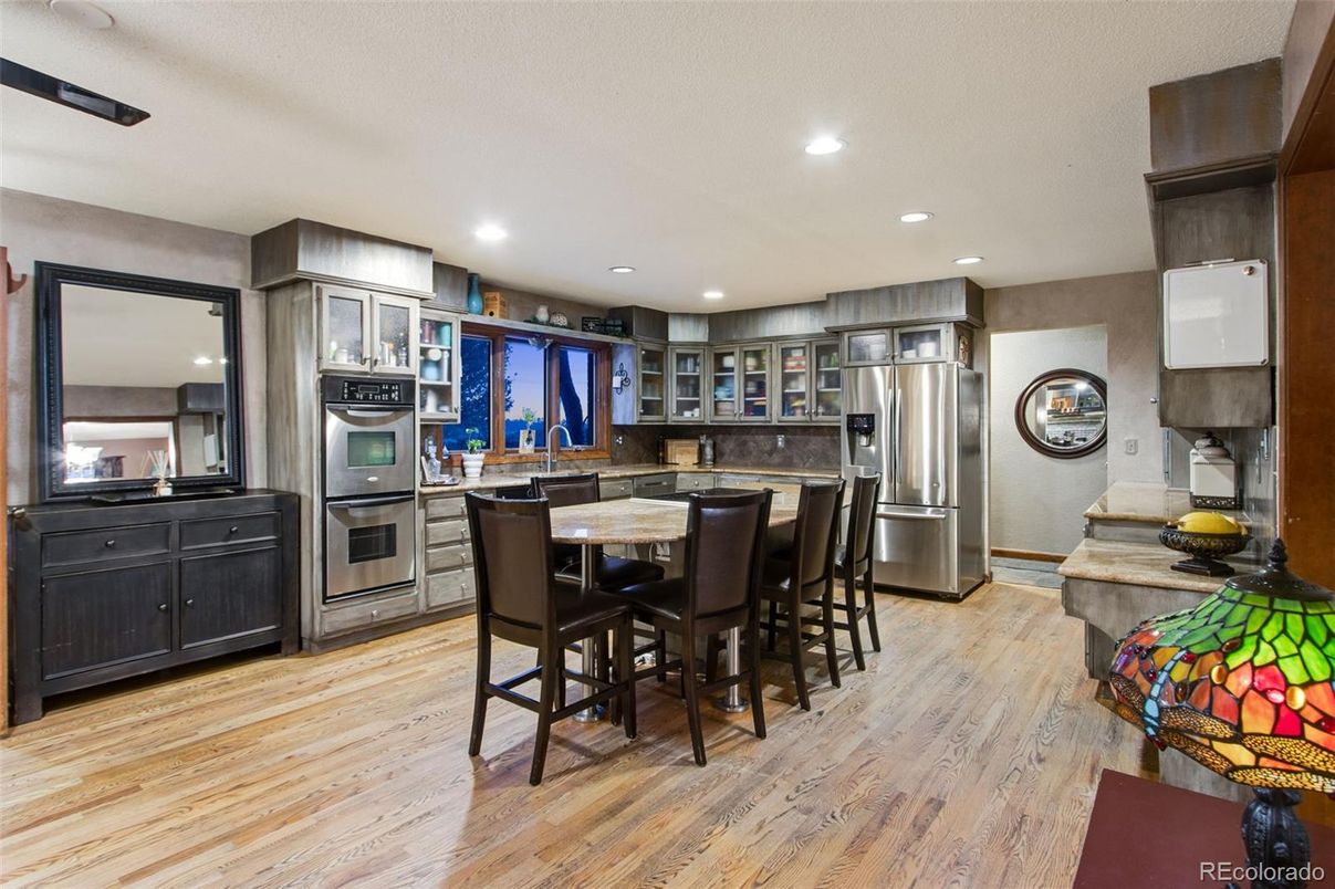 Dining room, Interior, Kitchen, Recessed Lighting, Stainless Steel Appliances, Wood Texture Flooring
