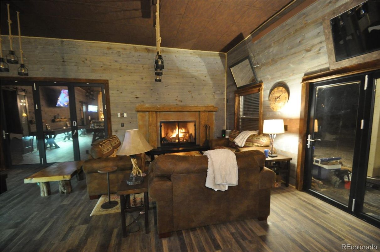 Fireplace, Interior, Living room, Pendant Lights, Stone Walls, Wood Texture Flooring, Wooden Walls