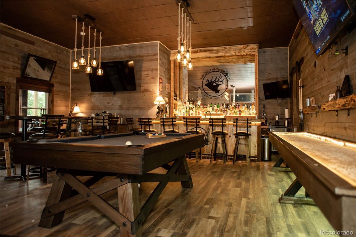 Billiard Table, Game Room, Interior, Pendant Lights, Stone Walls, Wood Texture Flooring, Wooden Walls
