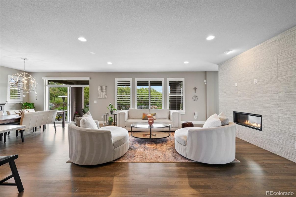 Dining room, Fireplace, Interior, Living room, Pendant Lights, Recessed Lighting, Wood Texture Flooring