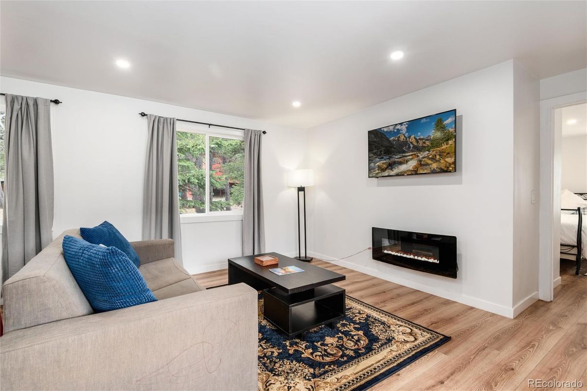 Fireplace, Interior, Living room, Recessed Lighting, Wood Texture Flooring