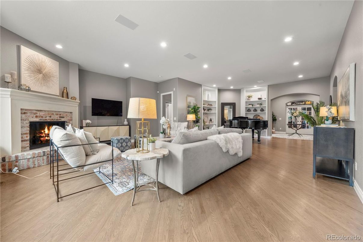 Fireplace, Interior, Living room, Piano, Recessed Lighting, Wood Texture Flooring