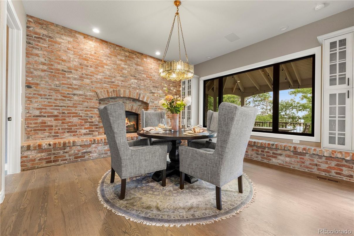 Dining room, Fireplace, Interior, Pendant Lights, Recessed Lighting, Stone Walls, Wood Texture Flooring
