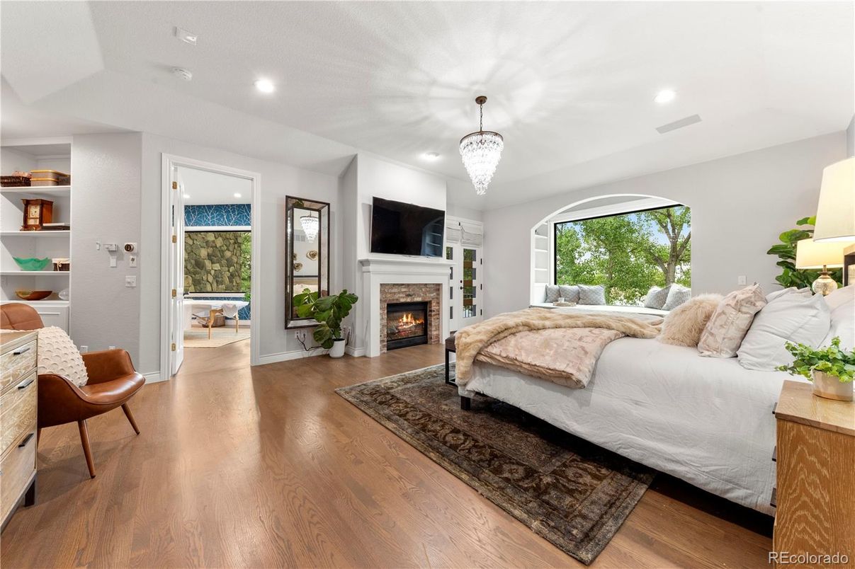 Bedroom, Chandelier, Fireplace, Interior, Recessed Lighting, Wood Texture Flooring