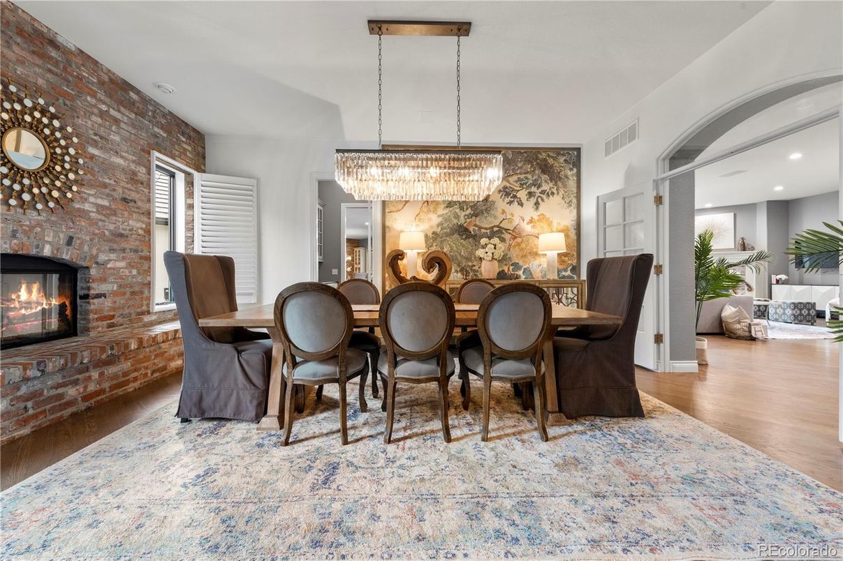 Chandelier, Dining room, Fireplace, Interior, Recessed Lighting, Stone Walls, Wood Texture Flooring