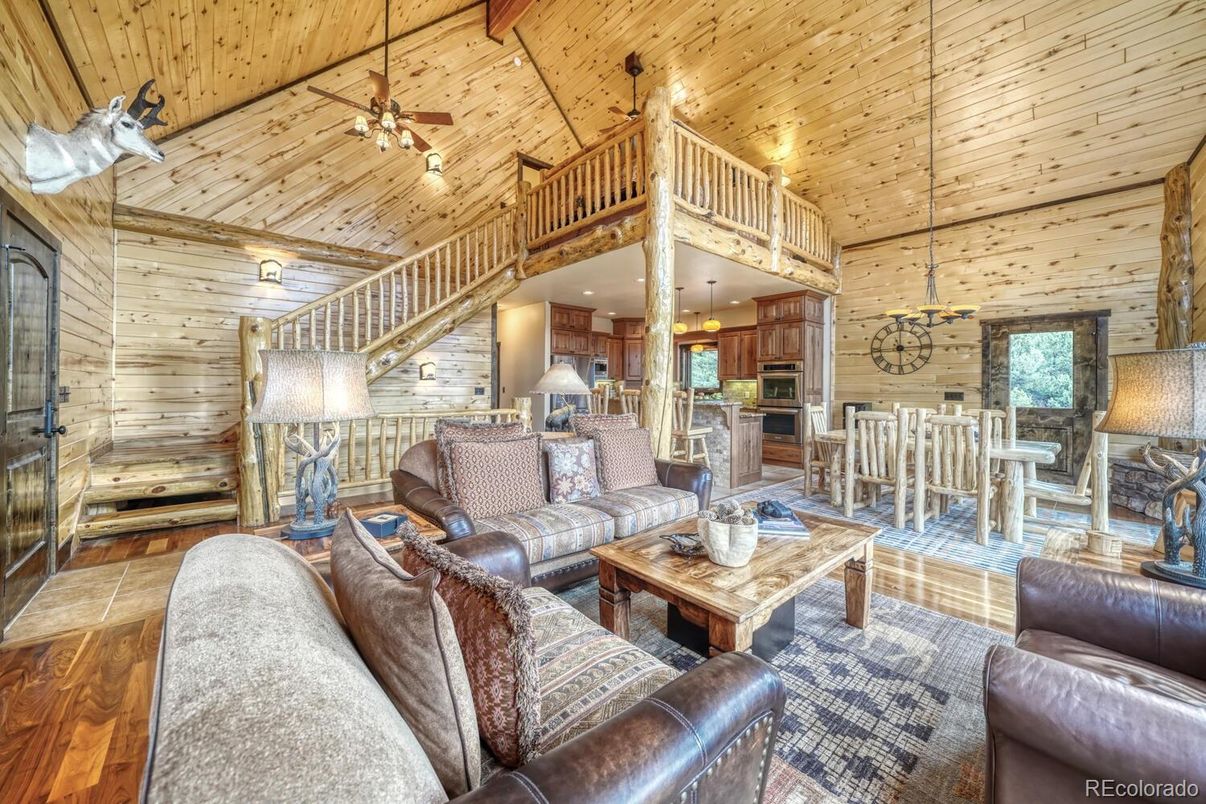 Dining room, Interior, Kitchen, Living room, Recessed Lighting, Stainless Steel Appliances, Wooden Ceilings, Wood Texture Flooring, Wooden Walls