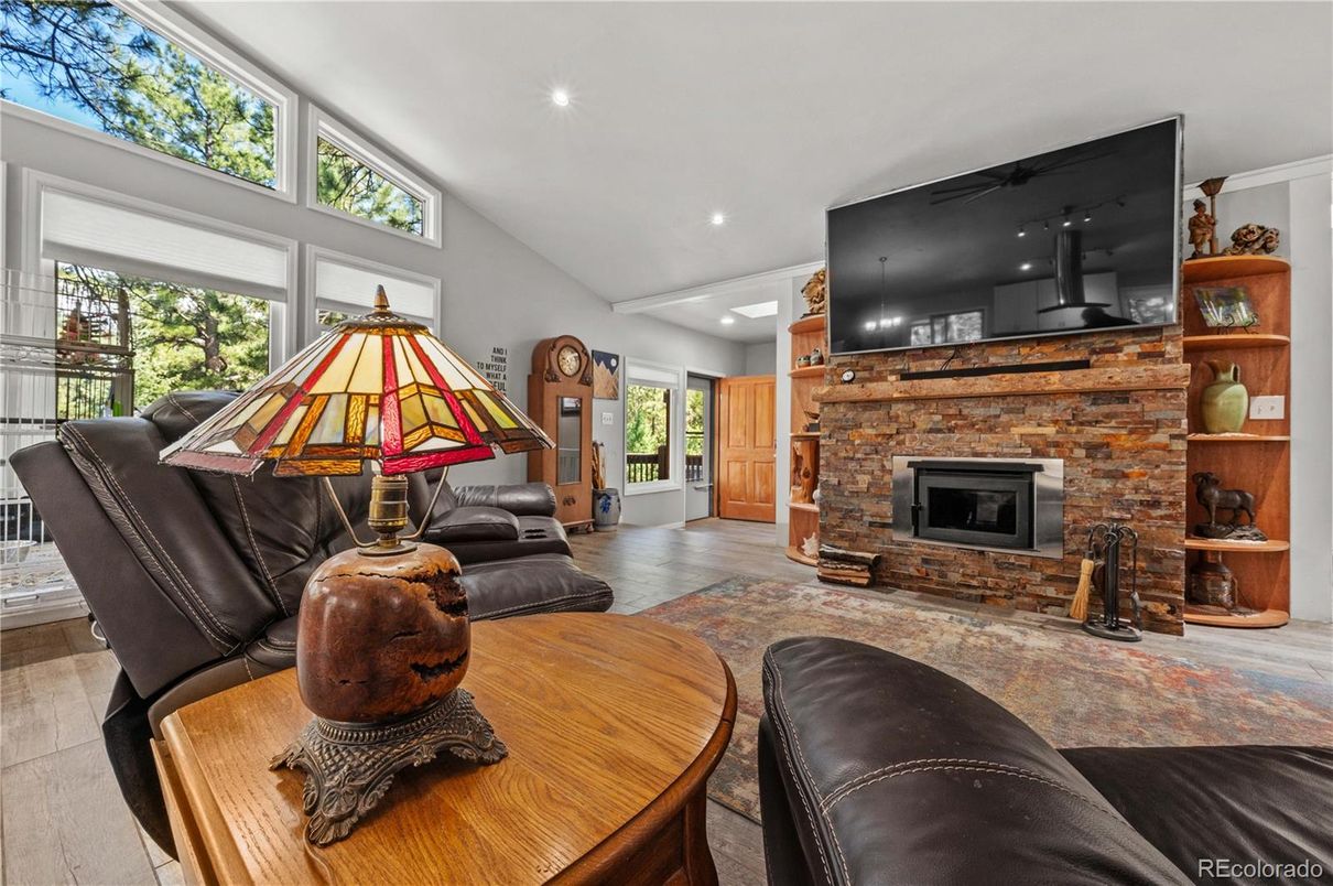 Fireplace, Interior, Living room, Recessed Lighting, Stone Walls, Wood Texture Flooring