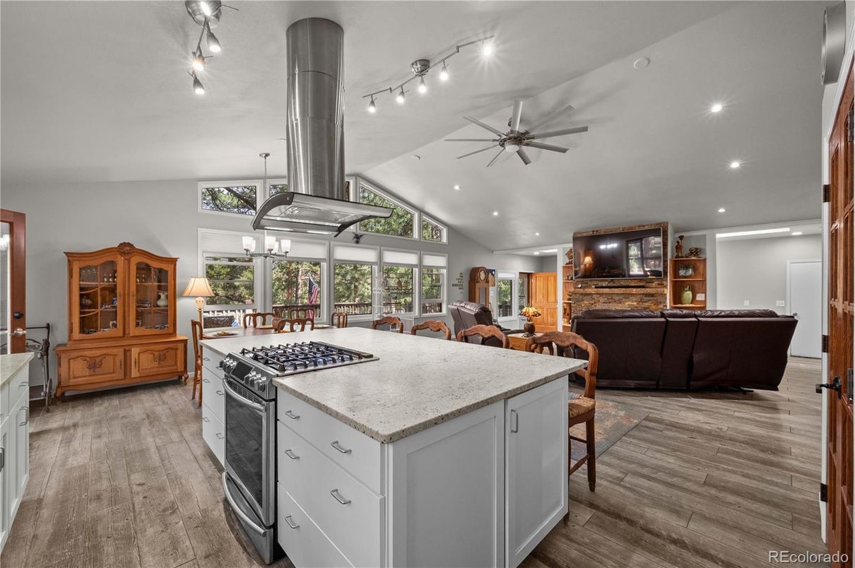 Dining room, Fireplace, Interior, Kitchen, Living room, Recessed Lighting, Wood Texture Flooring